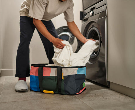 The Hold-All basket folded flat for storage, showing its 2cm depth.