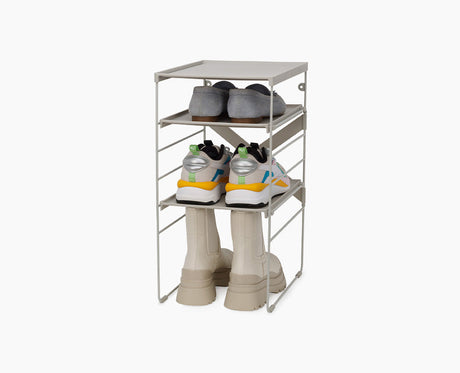 Joseph Joseph Level adjustable shoe rack in ecru on its steel frame.