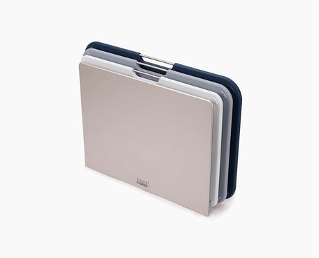 Joseph Joseph Nest Boards large 3-piece set in grey standing in its storage stand.