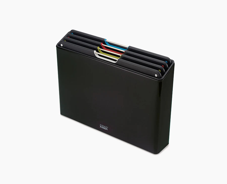 Joseph Joseph Folio Steel 4-piece chopping board set in its black stainless-steel case.