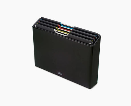 Joseph Joseph Folio Steel 4-piece chopping board set in its black stainless-steel case.