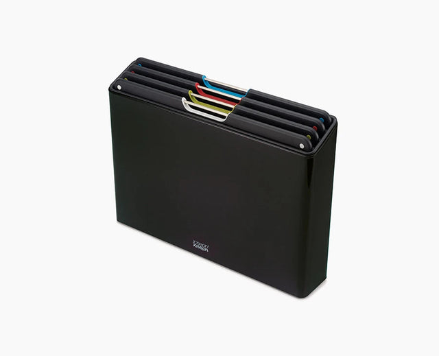 Joseph Joseph Folio Steel 4-piece chopping board set in its black stainless-steel case.