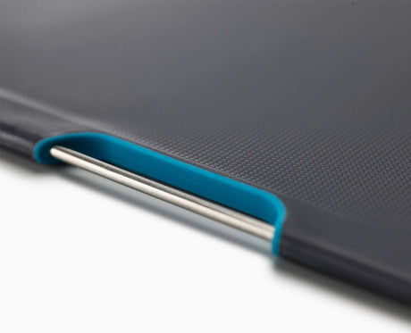 The Folio Steel case standing on a kitchen counter beside a knife.