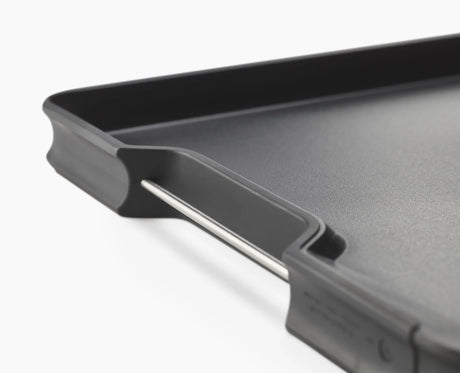 Angled base and raised edges shown from the side, collecting juices.