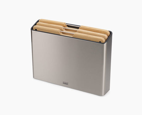Joseph Joseph Folio Steel three-piece bamboo chopping board set in its stainless-steel case.