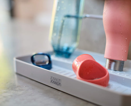 Joseph Joseph DrySmart folding bottle drying rack in stone drip-catching base detail, Homelux Kenya