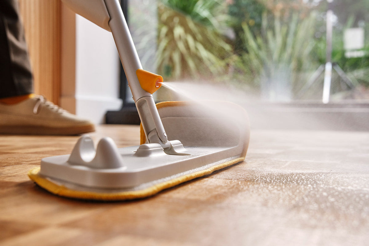 The mop head flipped over to show the spot-cleaning scrubber pad.