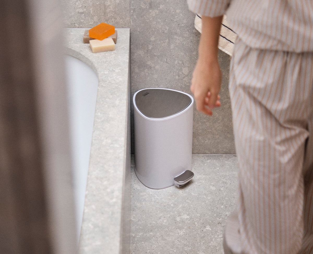 Joseph Joseph EasyStore 5L bin rear pocket holding a roll of IW8 liners