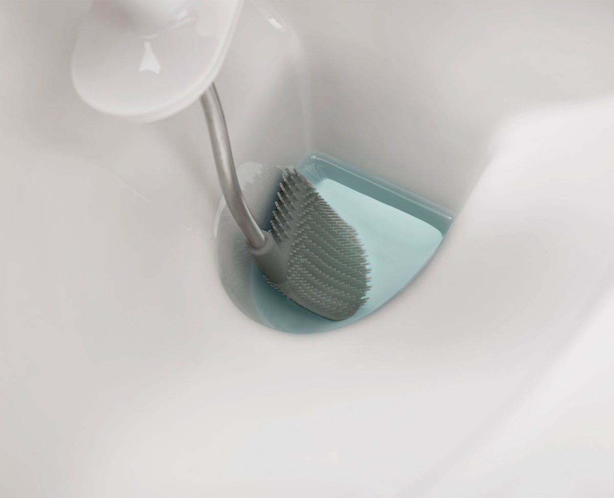 Joseph Joseph Flex Steel toilet brush and slimline holder beside a toilet, Homelux Kenya