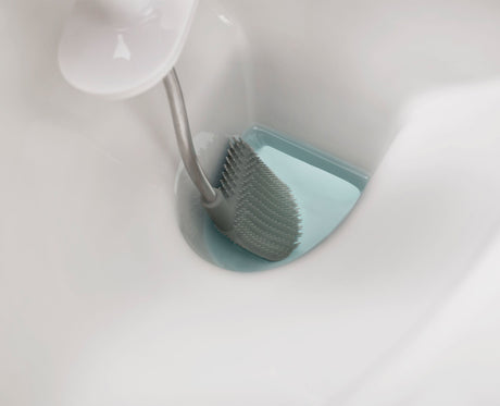 Joseph Joseph Flex Steel toilet brush and slimline holder beside a toilet, Homelux Kenya