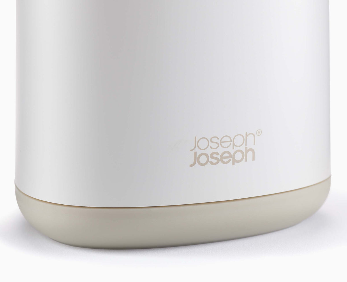 Joseph Joseph Flex 360 toilet brush and holder beside a toilet