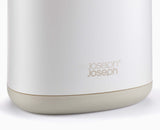 Joseph Joseph Flex 360 toilet brush and holder beside a toilet