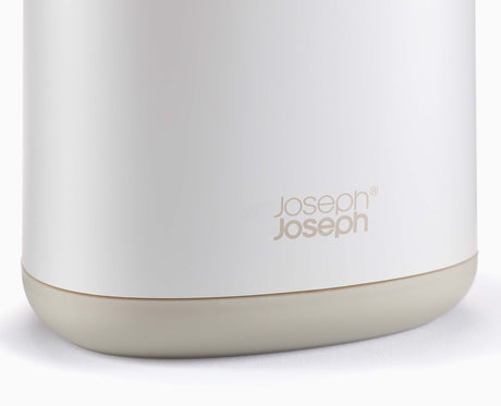 Joseph Joseph Flex 360 toilet brush and holder beside a toilet