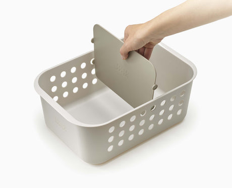 The divider being repositioned inside the EasyStore basket.