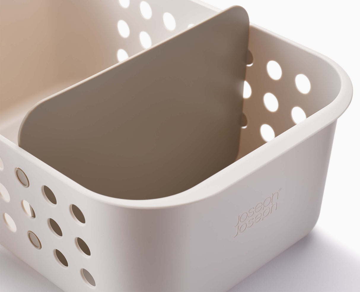 The basket stored on a bathroom shelf alongside other essentials.