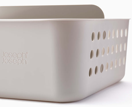 The basket sitting inside a drawer to organise its contents.