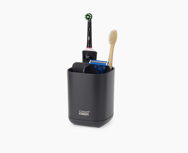 Joseph Joseph EasyStore toothbrush holder in matt black, holding brushes and toothpaste.