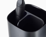 The toothbrush holder dismantled into its parts for cleaning.