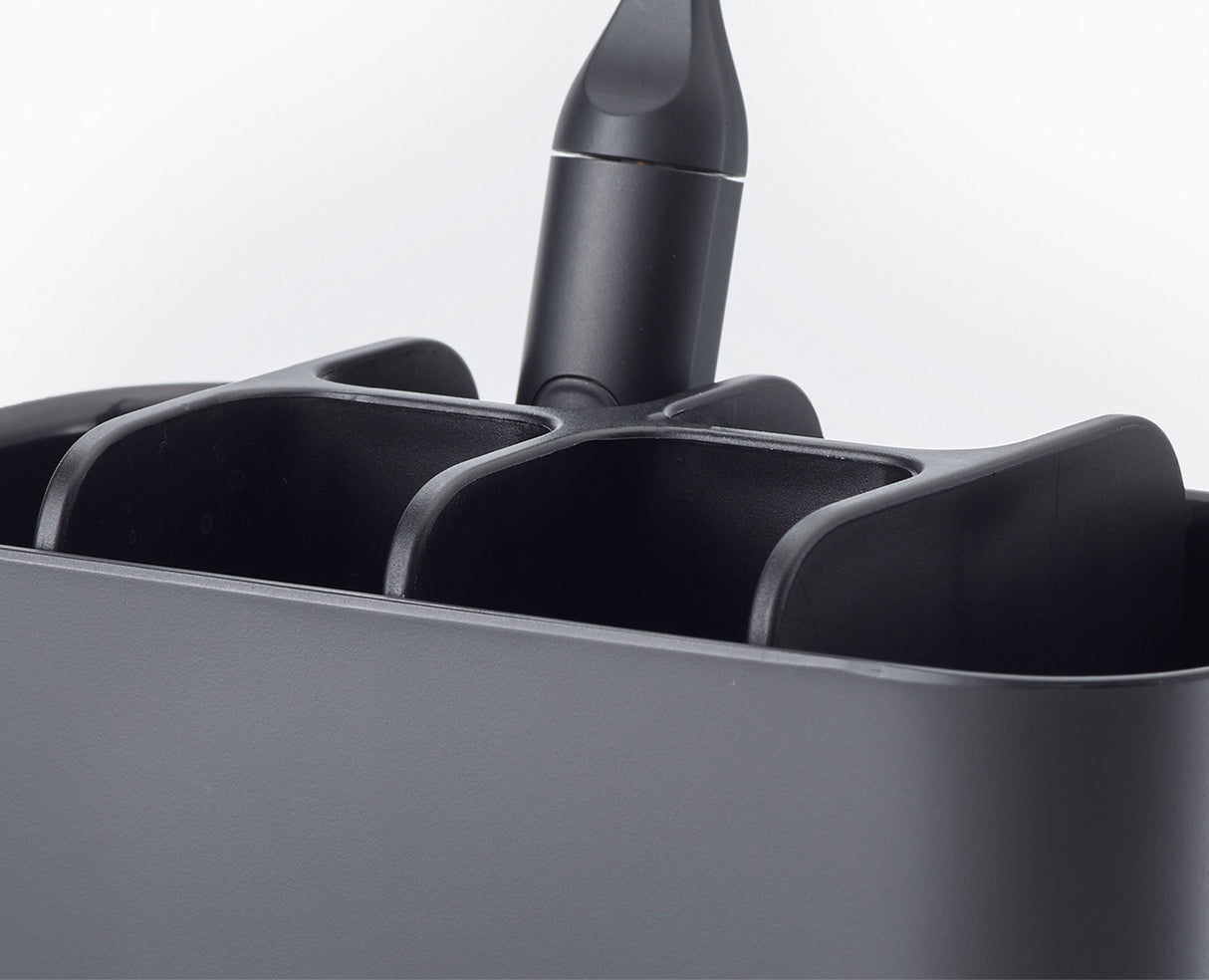 Close-up of the ventilated base of the large toothbrush holder.