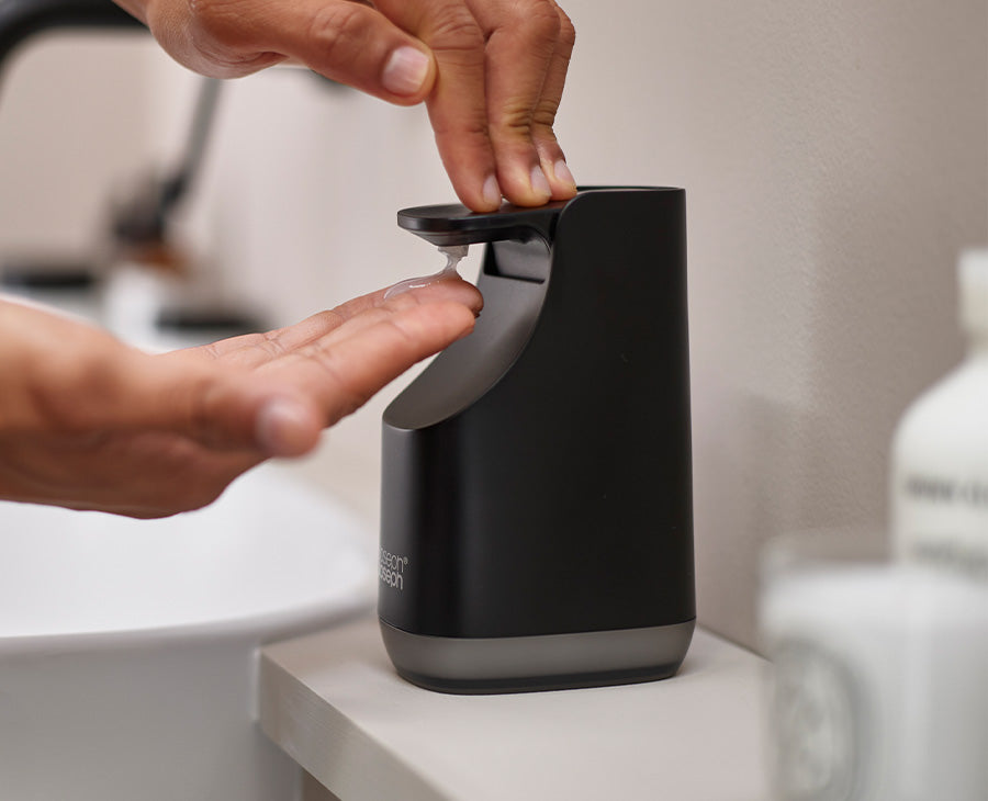 Joseph Joseph Slim Compact soap pump in matt black beside a bathroom basin, Homelux Kenya