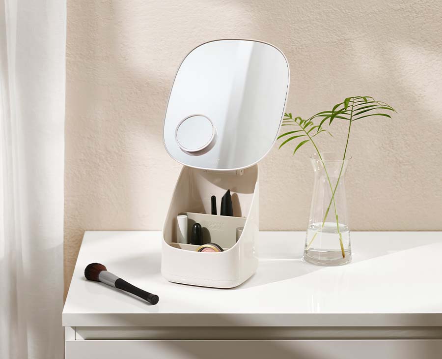 Side view of the Viva pedestal mirror showing the raised mirror above the storage base.