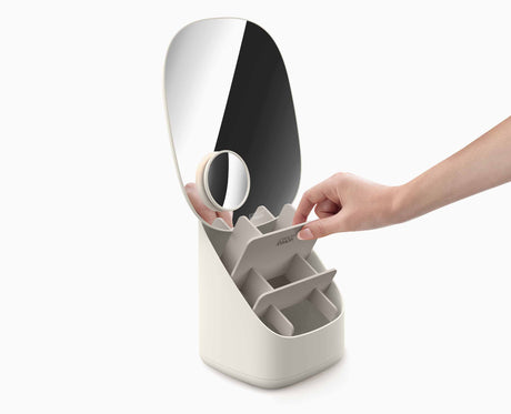 Close-up of the mirror face on its pedestal stand.