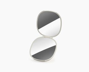 Joseph Joseph Viva 2-in-1 compact mirror in Shell, closed.