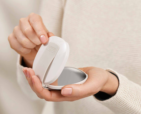 Close-up of the 3x magnifying mirror side of the compact.