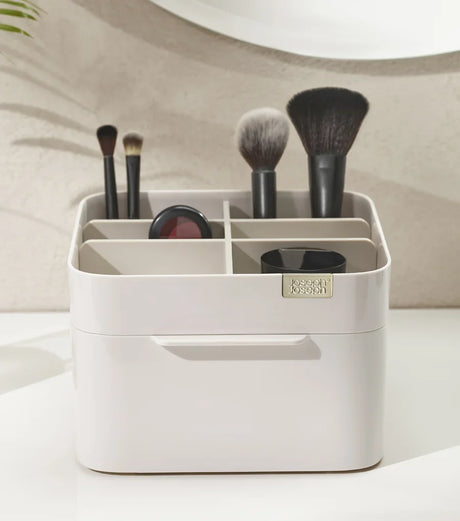 The cosmetic organiser from the front, showing its deep and shallow compartments.