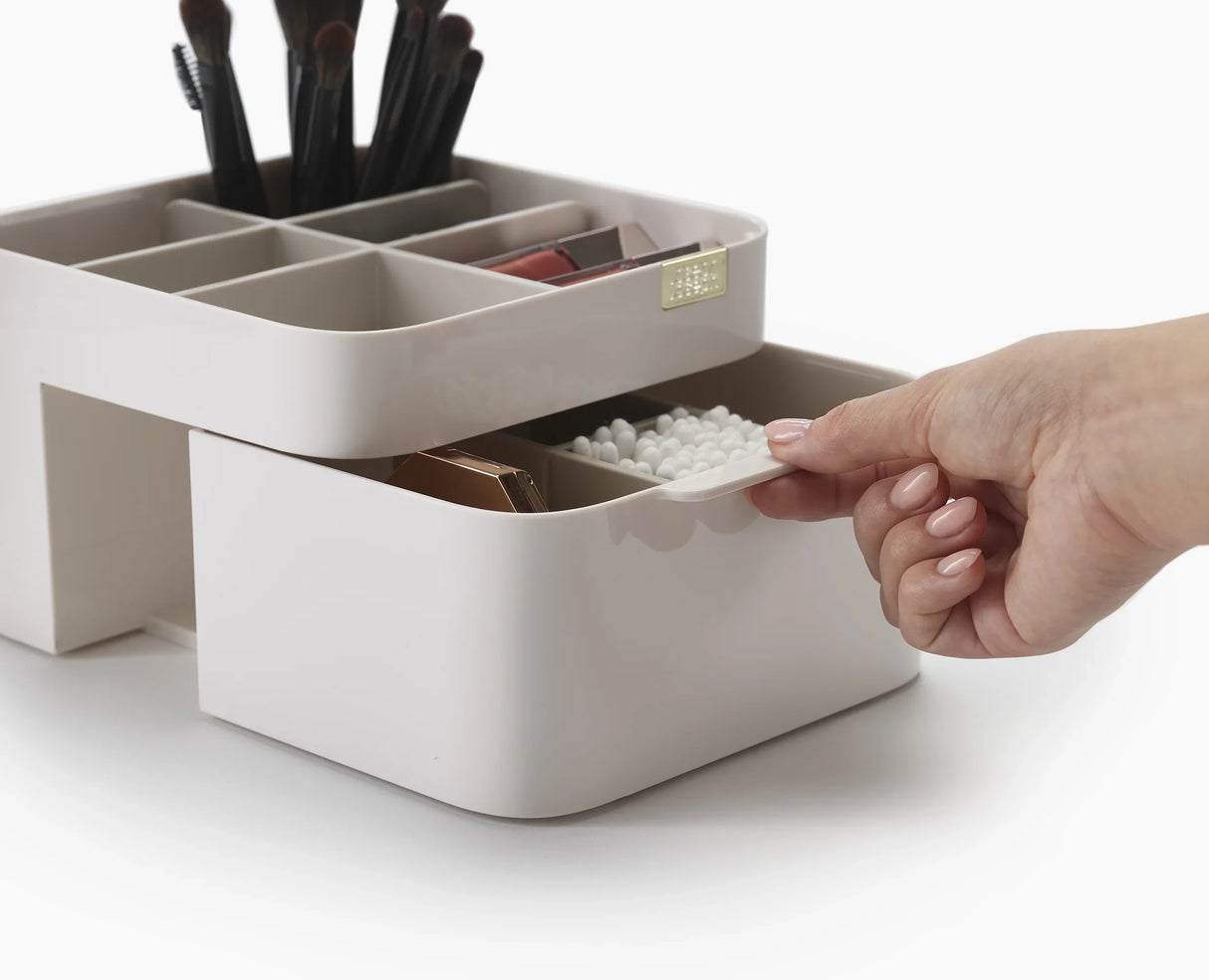 The 2-in-1 compact mirror closed, showing its magnetic closure.