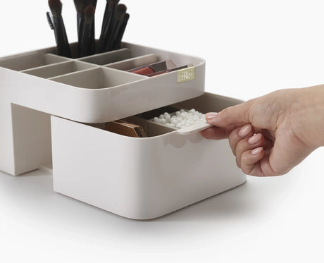 The 2-in-1 compact mirror closed, showing its magnetic closure.