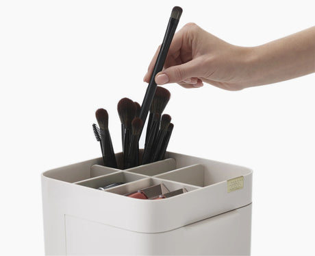 The compact opened to reveal the standard mirror and the 3x magnifying mirror.