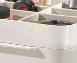 Both pieces of the set arranged on a dressing table.