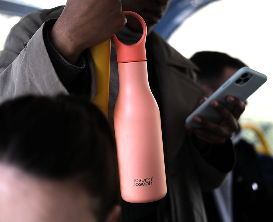 Detail of the storage loop holding the bottle cap while drinking.
