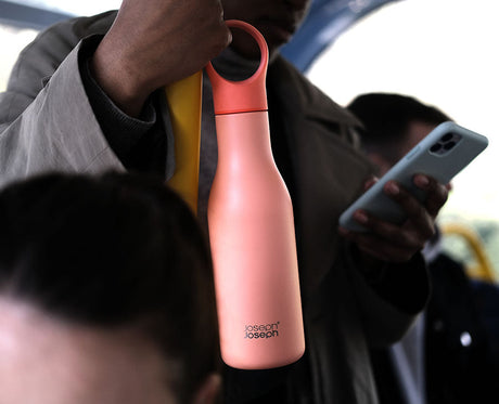 Detail of the storage loop holding the bottle cap while drinking.