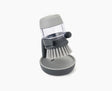 Joseph Joseph Palm Scrub washing-up brush in grey resting on its stand.