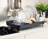 The rack pulled out to its extended width with the cutlery drainer in place.