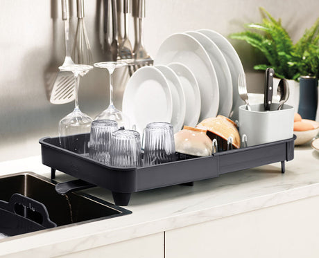 The rack pulled out to its extended width with the cutlery drainer in place.