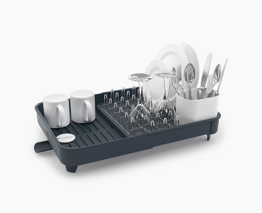Joseph Joseph Extend expandable dish rack in grey, shown at its compact width.