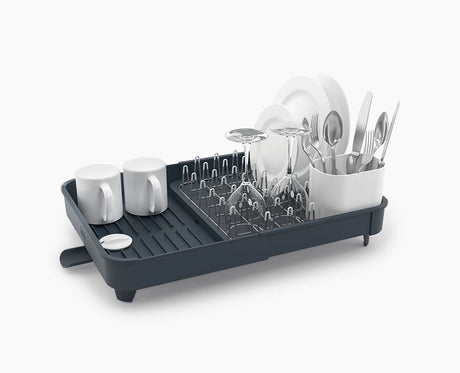 Joseph Joseph Extend expandable dish rack in grey, shown at its compact width.