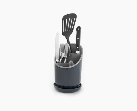 Joseph Joseph Dock cutlery drainer in grey, empty and seen from the front.