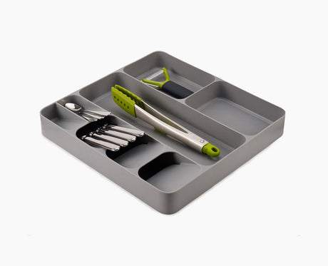 Joseph Joseph DrawerStore cutlery, utensil and gadget organiser in grey, fully loaded.