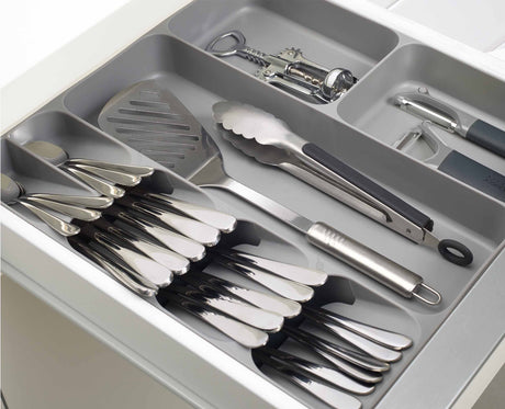 The twin gadget compartments holding bulkier kitchen tools such as a tin opener.
