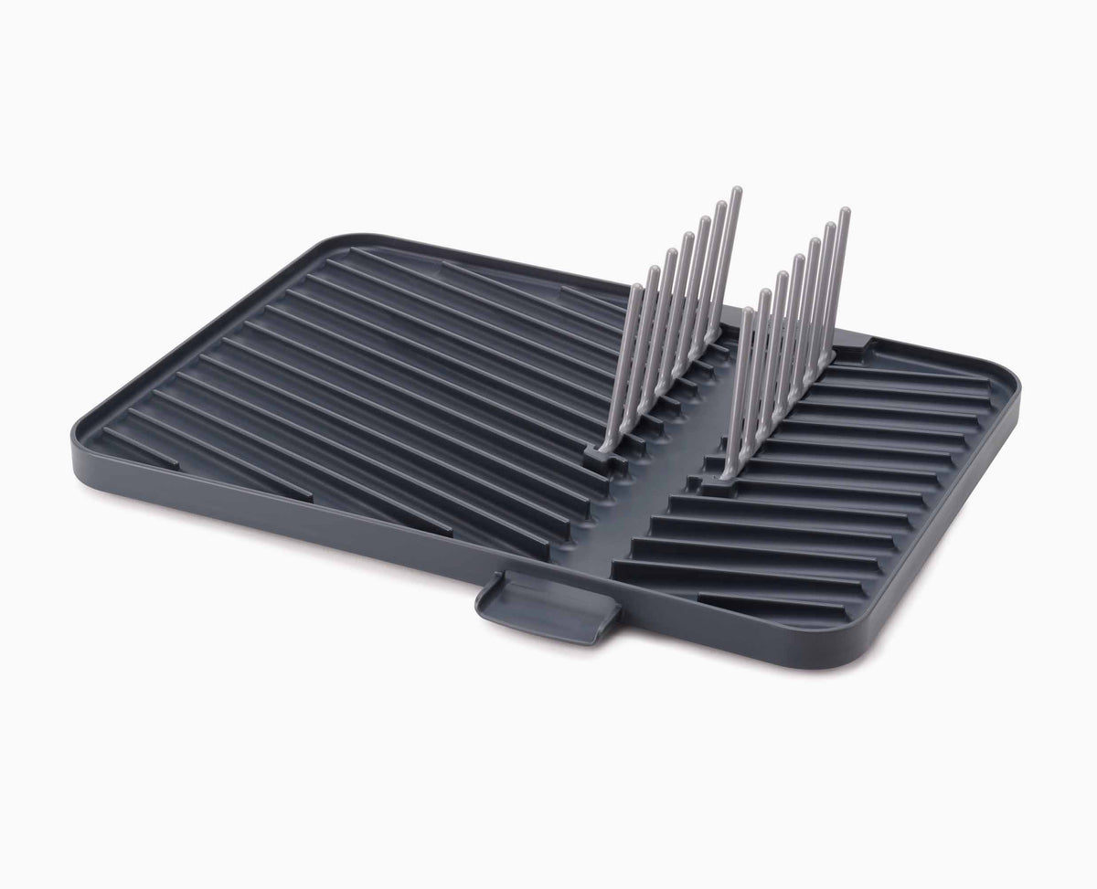 The rack part-folded, showing how it collapses down onto the flat draining surface.