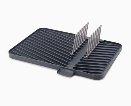 The rack part-folded, showing how it collapses down onto the flat draining surface.