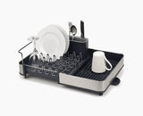 Joseph Joseph Extend stainless-steel dish drainer shown in its compact position.