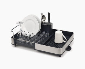 Joseph Joseph Extend stainless-steel dish drainer shown in its compact position.