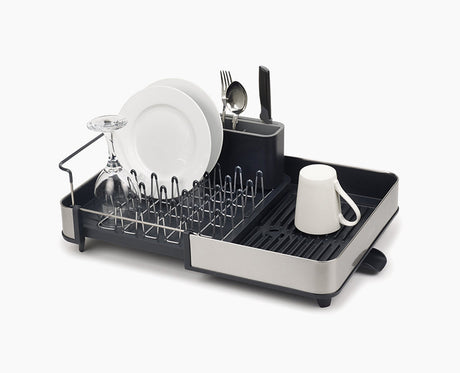 Joseph Joseph Extend stainless-steel dish drainer shown in its compact position.