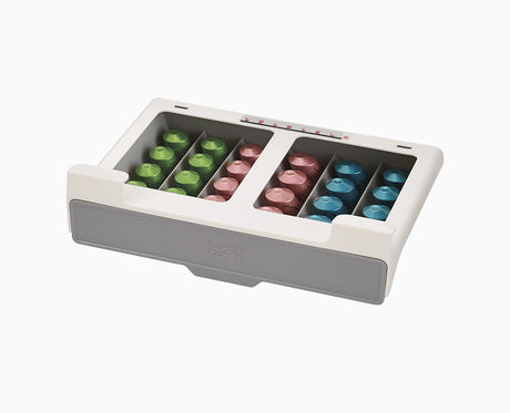 Joseph Joseph CupboardStore under-shelf coffee pod drawer in grey, filled with coffee pods.