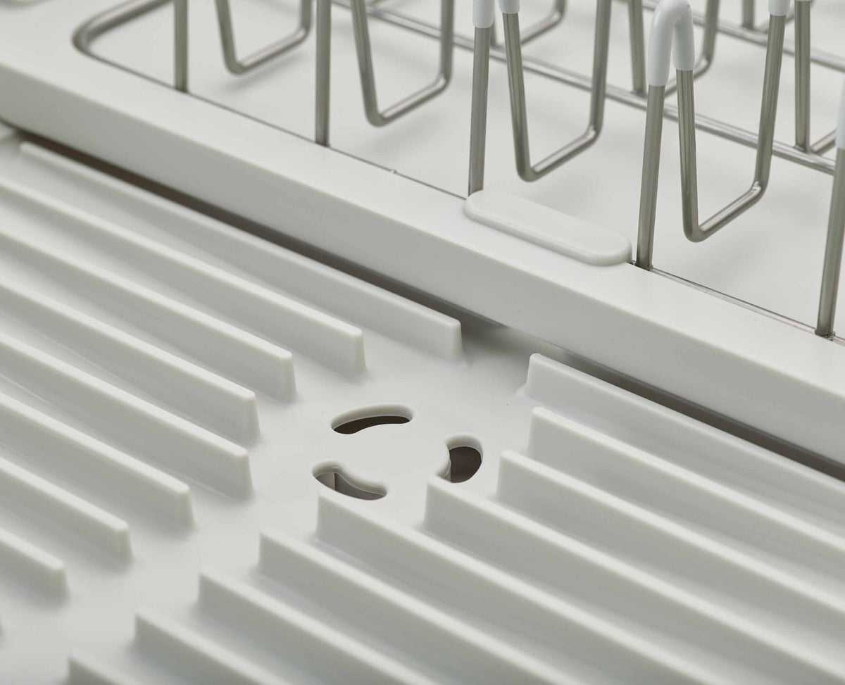 Joseph Joseph Extend Steel dish rack chopping board rail in use
